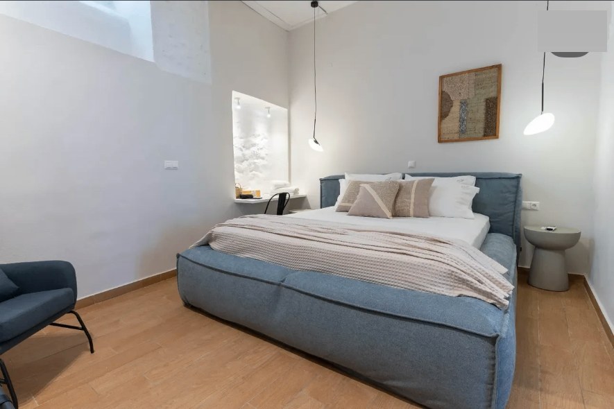 Aurelia bedroom — blue upholstered king bed